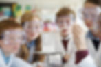 Kids observing chemistry experiment