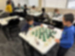 Children playing chess during a chess tournament at Flying Minds education centre chess club