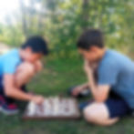 Children playing chess outdoor at Flying Minds education centre chess club