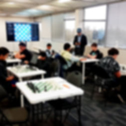Children playing chess during a chess tournament at Flying Minds education centre chess club