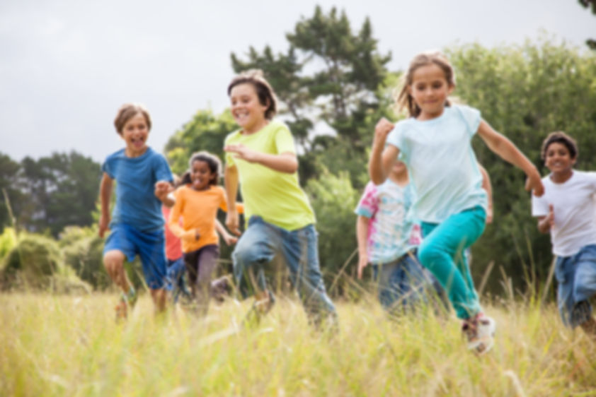 Group of children running outside