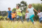 Group of children running outside
