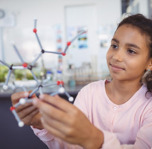 Girl Holding Molecule